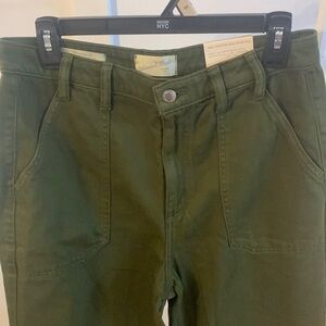 Universal Thread high rise wide leg jeans in a camo green or dark green color.
